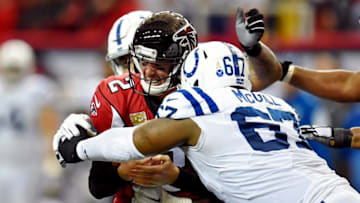 Nov 22, 2015; Atlanta, GA, USA; Atlanta Falcons quarterback Matt Ryan (2) is sacked by Indianapolis Colts defensive tackle Billy Winn (99) and defensive tackle T.Y. McGill (67) during the fourth quarter at the Georgia Dome. The Colts defeated the Falcons 24-21. Mandatory Credit: Dale Zanine-USA TODAY Sports