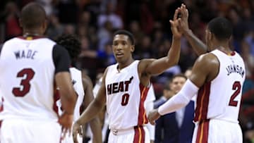 Mar 25, 2016; Miami, FL, USA; Miami Heat guard Josh Richardson (0) celebrates with forward Joe Johnson (2) and guard Dwyane Wade (3) in the second half of a game against the Orlando Magic at American Airlines Arena. The Heat won 108-97. Mandatory Credit: Robert Mayer-USA TODAY Sports