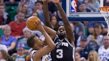 Nov 4, 2016; Salt Lake City, UT, USA; San Antonio Spurs center Dewayne Dedmon (3) defends against the shot of Utah Jazz guard Rodney Hood (5) during the second half at Vivint Smart Home Arena. San Antonio won 100-86. Mandatory Credit: Russ Isabella-USA TODAY Sports