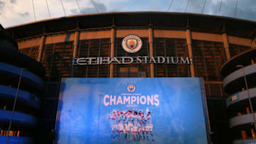 MANCHESTER, ENGLAND - MAY 11: A champions banner is seen outside Etihad Stadium as Manchester City fans celebrate winning the Premier League title on May 11, 2021 in Manchester, England. Manchester City Football club claims the Premier League title as nearest rival Manchester United lost to Leicester today 1-2. Football fans are currently unable to attend matches due to coronavirus restrictions. (Photo by Alex Livesey - Danehouse/Getty Images)