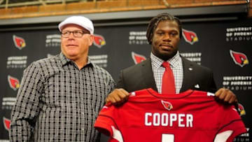 Apr. 26, 2013; Tempe, AZ, USA; Arizona Cardinals head coach Bruce Arians and offensive guard Jonathan Cooper pose for a photo during a press conference at the Cardinals Training Facility. Mandatory Credit: Matt Kartozian-USA TODAY Sports