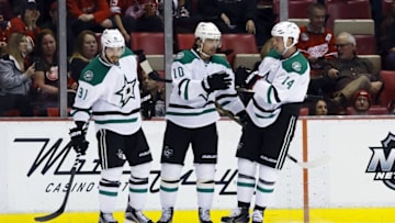 Nov 8, 2015; Detroit, MI, USA; Dallas Stars left wing Patrick Sharp (10) receives congratulations from center Tyler Seguin (91) and left wing Jamie Benn (14) after scoring in the first period against the Detroit Red Wings at Joe Louis Arena. Mandatory Credit: Rick Osentoski-USA TODAY Sports