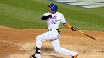 Oct 30, 2015; New York City, NY, USA; New York Mets center fielder Yoenis Cespedes drives in a run with a sacrifice fly against the Kansas City Royals in the 6th inning in game three of the World Series at Citi Field. Mandatory Credit: Brad Penner-USA TODAY Sports