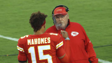KANSAS CITY, MISSOURI - SEPTEMBER 10: head coach Andy Reid of the Kansas City Chiefs talks with Patrick Mahomes #15 before the start of a game against the Houston Texans at Arrowhead Stadium on September 10, 2020 in Kansas City, Missouri. (Photo by Jamie Squire/Getty Images)