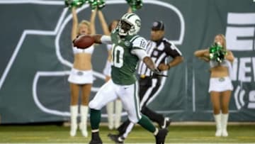 Sep 22, 2013; East Rutherford, NJ, USA; New York Jets wide receiver Santonio Holmes (10) scores a touchdown against the Buffalo Bills in the 4th quarter at MetLife Stadium. Mandatory Credit: Robert Deutsch-USA TODAY Sports