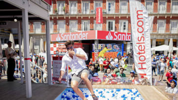 MADRID, SPAIN - JUNE 01: Jack Fincham makes a splash in the ball pit at the Hotels.com Champions Retreat in Plaza Mayor ahead of the UEFA Champions League Final on June 01, 2019 in Madrid, Spain. (Photo by Samuel de Roman/Getty Images for Hotels.com)