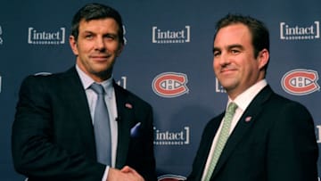 BROSSARD, CANADA - MAY 2: Montreal Canadiens General Manager Marc Bergevin and team owner Geoff Molson shake hands after a press conference introducing Bergevin as the new General Manager of the team at the Bell SportsPlex on May 2, 2012 in Brossard, Quebec, Canada. (Photo by Richard Wolowicz/Getty Images)