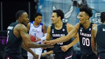 Nov 29, 2020; Kansas City, MO, USA; South Carolina Gamecocks guard AJ Lawson (00) celebrates with guard Jermaine Couisnard (5) after scoring against the Tulsa Golden Hurricane during the second half at T-Mobile Center. Mandatory Credit: Jay Biggerstaff-USA TODAY Sports