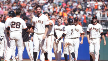 Jun 26, 2016; San Francisco, CA, USA; San Francisco Giants third baseman Conor Gillaspie (21) celebrates with teammates after hitting an RBI double for the walk off win against the Philadelphia Phillies during the ninth inning at AT&T Park. The Giants won 8-7. Mandatory Credit: Kelley L Cox-USA TODAY Sports