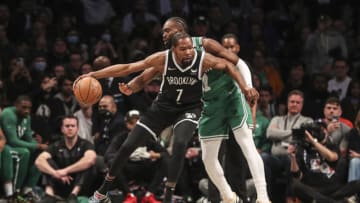 Apr 23, 2022; Brooklyn, New York, USA; Boston Celtics guard Jaylen Brown (7) knocks the ball away from Brooklyn Nets forward Kevin Durant (7) in the first quarter at Barclays Center. Mandatory Credit: Wendell Cruz-USA TODAY Sports