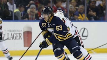 Dec 19, 2015; Buffalo, NY, USA; Buffalo Sabres left wing Tyler Ennis (63) brings the puck up ice during the second period against the Chicago Blackhawks at First Niagara Center. Mandatory Credit: Kevin Hoffman-USA TODAY Sports