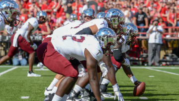 DFS CFB: LINCOLN, NE - SEPTEMBER 15: The offensive line of the Troy Trojans prepares for the opening snap against the Nebraska Cornhuskers at Memorial Stadium on September 15, 2018 in Lincoln, Nebraska. (Photo by Steven Branscombe/Getty Images)