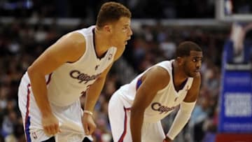 Dec 28, 2013; Los Angeles, CA, USA; Los Angeles Clippers guard Chris Paul (3) and Los Angeles Clippers forward Blake Griffin (32) rest during a break in play against the Utah Jazz during the fourth period at Staples Center. The Los Angeles Clippers defeated the Utah Jazz 98-90. Mandatory Credit: Kelvin Kuo-USA TODAY Sports