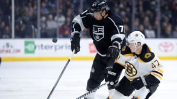 LOS ANGELES, CA - DECEMBER 02: Jordan Nolan #71 of the Los Angeles Kings and Torey Krug #47 of the Boston Bruins follow the puck during the second period at Staples Center on December 2, 2014 in Los Angeles, California. (Photo by Harry How/Getty Images)