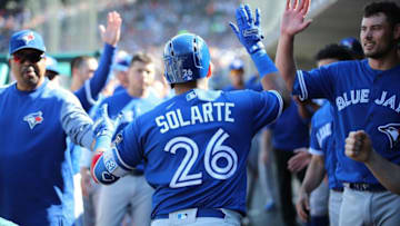 DETROIT, MI - JUNE 2: Yangervis Solarte #26 of the Toronto Blue Jays celebrates with teammates in the dugout after hitting a solo home run during the fifth inning of the game against the Detroit Tigers at Comerica Park on June 2, 2018 in Detroit, Michigan. (Photo by Leon Halip/Getty Images)
