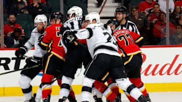 CALGARY, AB - JANUARY 24: Teammates of the Calgary Flames get close against members of the Los Angeles Kings during an NHL game on January 24, 2018 at the Scotiabank Saddledome in Calgary, Alberta, Canada. (Photo by Gerry Thomas/NHLI via Getty Images)