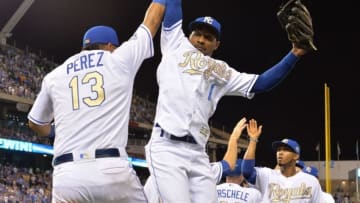 Jun 17, 2016; Kansas City, MO, USA; Kansas City Royals catcher Salvador Perez (13) and right fielder Jarrod Dyson (1) celebrate after a win over the Detroit Tigers at Kauffman Stadium. The Royals won 10-3. Mandatory Credit: Denny Medley-USA TODAY Sports