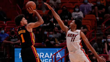 Oct 4, 2021; Miami, Florida, USA; Atlanta Hawks forward Jalen Johnson (1) attempts a three point shot over Miami Heat forward KZ Okpala (11) during the second half at FTX Arena. Mandatory Credit: Jasen Vinlove-USA TODAY Sports