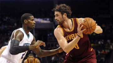 Feb 3, 2016; Charlotte, NC, USA; Cleveland Cavaliers forward center Kevin Love (0) looks to pass as he is defended by Charlotte Hornets forward Marvin Williams (2) during the first half of the game at Time Warner Cable Arena. Mandatory Credit: Sam Sharpe-USA TODAY Sports