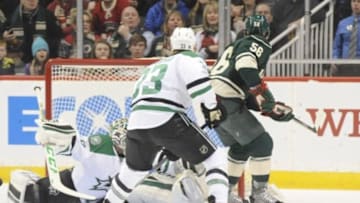 Feb 9, 2016; Saint Paul, MN, USA; Minnesota Wild forward Erik Haula (56) scores on Dallas Stars goalie Kari Lehtonen (32) during the first period at Xcel Energy Center. Mandatory Credit: Marilyn Indahl-USA TODAY Sports