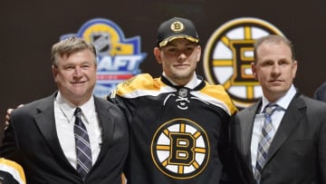 Jun 26, 2015; Sunrise, FL, USA; Jakub Zboril poses for a photo with team executives after being selected as the number thirteen overall pick to the Boston Bruins in the first round of the 2015 NHL Draft at BB&T Center. Mandatory Credit: Steve Mitchell-USA TODAY Sports
