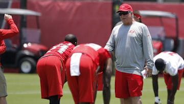 Jun 14, 2016; Tampa Bay, FL, USA; Tampa Bay Buccaneers defensive coordinator Mike Smith (right) talks with cornerback Alterraun Verner (21) works out during mini camp at One Buccaneer Place. Mandatory Credit: Kim Klement-USA TODAY Sports