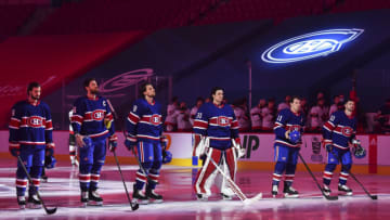 MONTREAL, QC - FEBRUARY 04: (L-R) Phillip Danault #24, Shea Weber #6, Ben Chiarot #8, Carey Price #31, Brendan Gallagher #11 and Tomas Tatar #90 of the Montreal Canadiens stand for the national anthem prior to their game against the Ottawa Senators at the Bell Centre on February 4, 2021 in Montreal, Canada. The Ottawa Senators defeated the Montreal Canadiens 3-2. (Photo by Minas Panagiotakis/Getty Images)