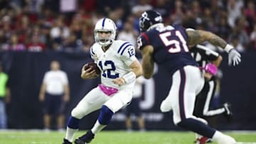 Oct 16, 2016; Houston, TX, USA; Indianapolis Colts quarterback Andrew Luck (12) runs with the ball on a keeper as Houston Texans outside linebacker John Simon (51) defends during the first quarter at NRG Stadium. Mandatory Credit: Troy Taormina-USA TODAY Sports