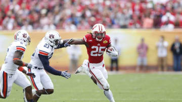 TAMPA, FL - JANUARY 1: Melvin Gordon #25 of the Wisconsin Badgers runs with the ball against the Auburn Tigers during the Outback Bowl at Raymond James Stadium on January 1, 2015 in Tampa, Florida. Wisconsin defeated Auburn 34-31 in overtime. (Photo by Joe Robbins/Getty Images)