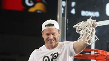 Louisville’s Jeff Walz cuts the net down for advancing to the Final Four. March 28, 2022Louisvillemichigan 05
