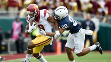 PASADENA, CA - JANUARY 02: Cornerback John Reid #29 of the Penn State Nittany Lions attempts to tackle wide receiver JuJu Smith-Schuster #9 of the USC Trojans in the first half of the 2017 Rose Bowl Game presented by Northwestern Mutual at the Rose Bowl on January 2, 2017 in Pasadena, California. (Photo by Kevork Djansezian/Getty Images)