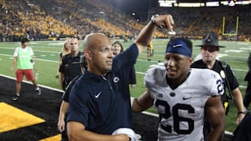 IOWA CITY, IOWA- SEPTEMBER 23: Head coach James Franklin of the Penn State Nittany Lions points to running back Saquon Barkley