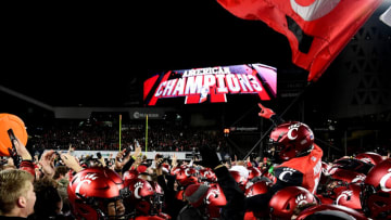 CINCINNATI, OHIO - DECEMBER 04: The Cincinnati Bearcats celebrate their 35-20 win over the Houston Cougars for the 2021 American Conference Championship at Nippert Stadium on December 04, 2021 in Cincinnati, Ohio. (Photo by Emilee Chinn/Getty Images)