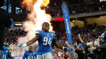 Dec 14, 2014; Detroit, MI, USA; Detroit Lions defensive end Ezekiel Ansah (94) runs onto the field giving fans high fives before the game against the Minnesota Vikings at Ford Field. Mandatory Credit: Raj Mehta-USA TODAY Sports