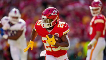 Oct 16, 2022; Kansas City, Missouri, USA; Kansas City Chiefs running back Clyde Edwards-Helaire (25) runs the ball during the first half against the Buffalo Bills at GEHA Field at Arrowhead Stadium. Mandatory Credit: Jay Biggerstaff-USA TODAY Sports