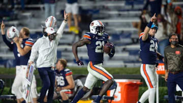 Auburn defensive back Smoke Monday (21) returns an interception for a touchdown at Jordan-Hare Stadium in Auburn, Ala., on Saturday, Nov. 21, 2020. Auburn defeated Tennessee 30-17.