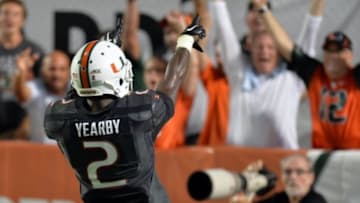Sep 27, 2014; Miami Gardens, FL, USA; Miami Hurricanes running back Joseph Yearby (2) celebrates his touchdown catch during the second half against the Duke Blue Devils at Sun Life Stadium. Miami won 22-10. Mandatory Credit: Steve Mitchell-USA TODAY Sports