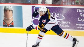 WINDSOR, ON - FEBRUARY 25: Forward Ben Hawerchuk #11 of the Barrie Colts fires the puck against the Windsor Spitfires on February 25, 2016 at the WFCU Centre in Windsor, Ontario, Canada. (Photo by Dennis Pajot/Getty Images)