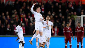SWANSEA, WALES - JANUARY 22: Alfie Mawson of Swansea City celebrates scoring his side's first goal during the Premier League match between Swansea City and Liverpool at Liberty Stadium on January 22, 2018 in Swansea, Wales. (Photo by Stu Forster/Getty Images)