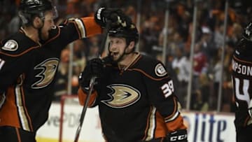 May 25, 2015; Anaheim, CA, USA; Anaheim Ducks left wing Matt Beleskey (right) is congratulated for scoring the game-winning goal against the Chicago Blackhawks during the overtime period in game five of the Western Conference Final of the 2015 Stanley Cup Playoffs at Honda Center. Mandatory Credit: Gary A. Vasquez-USA TODAY Sports