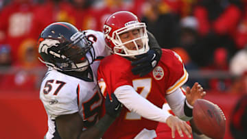 KANSAS CITY, MO - DECEMBER 05: Quarterback Matt Cassel #7 of the Kansas City Chiefs is hit as he throws by linebacker Mario Haggan #57 of the Denver Broncos in a game at Arrowhead Stadium on December 5, 2010 in Kansas City, MO. The Chiefs won 10-6. (Photo by Tim Umphrey/Getty Images)