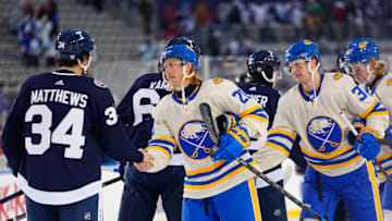 Mar 13, 2022; Hamilton, Ontario, CAN; Toronto Maple Leafs forward Auston Matthews (34) and Buffalo Sabres forward Cody Eakin (20) and Buffalo Sabres forward Casey Mittelstadt (37) shakes hands after the end of the game in the 2022 Heritage Classic ice hockey game at Tim Hortons Field. Mandatory Credit: John E. Sokolowski-USA TODAY Sports