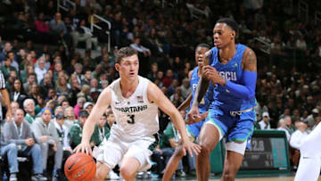 EAST LANSING, MI - NOVEMBER 11: Foster Loyer #3 of the Michigan State Spartans drives to the basket while defended by Troy Baxter Jr #1 of the Florida Gulf Coast Eagles in the first half at Breslin Center on November 11, 2018 in East Lansing, Michigan. (Photo by Rey Del Rio/Getty Images)