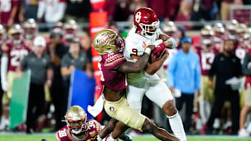 Dec 29, 2022; Orlando, Florida, USA; Florida State Seminoles defensive back Jammie Robinson (10) tackles Oklahoma Sooners tight end Brayden Willis (9) during the second half in the 2022 Cheez-It Bowl at Camping World Stadium. Mandatory Credit: Rich Storry-USA TODAY Sports