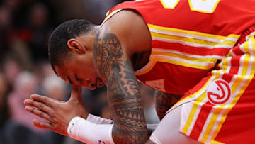 ATLANTA, GEORGIA - DECEMBER 13: John Collins #20 of the Atlanta Hawks reacts after being charged with an offensive foul against Alperen Sengun #28 of the Houston Rockets during the second half at State Farm Arena on December 13, 2021 in Atlanta, Georgia. After an official review, the call was overturned and Collins was awarded free throws. NOTE TO USER: User expressly acknowledges and agrees that, by downloading and or using this photograph, User is consenting to the terms and conditions of the Getty Images License Agreement. (Photo by Kevin C. Cox/Getty Images)