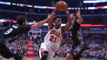 Feb 27, 2015; Chicago, IL, USA; Chicago Bulls guard Jimmy Butler (center) drives between Minnesota Timberwolves guard Ricky Rubio (left) and guard Gary Neal (right) during the second half at the United Center. Chicago won 96-89. Mandatory Credit: Dennis Wierzbicki-USA TODAY Sports