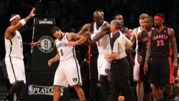 Apr 25, 2014; Brooklyn, NY, USA; Brooklyn Nets center Kevin Garnett (2) keeps guard Deron Williams (8) from a tussle with Toronto Raptors during the second quarter in game three of the first round of the 2014 NBA Playoffs at Barclays Center. Mandatory Credit: Anthony Gruppuso-USA TODAY Sports