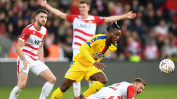 DONCASTER, ENGLAND - FEBRUARY 17: Michy Batshuayi of Crystal Palace battles with Herbie Kane of Doncaster Rovers during the FA Cup Fifth Round match between Doncaster Rovers and Crystal Palace at Keepmoat Stadium on February 17, 2019 in Doncaster, United Kingdom. (Photo by Michael Regan/Getty Images)