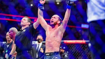 Jan 22, 2022; Anaheim, California, USA; Victor Henry (blue gloves) celebrates his win by unanimous decision against Raoni Barcelos (red gloves) during UFC 270 at Honda Center. Mandatory Credit: Gary A. Vasquez-USA TODAY Sports
