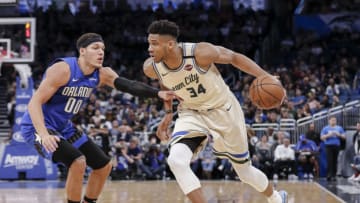 ORLANDO, FL - FEBRUARY 08: Giannis Antetokounmpo #34 of the Milwaukee Bucks is defended by Aaron Gordon #00 of the Orlando Magic during the game at the Amway Center on February 8, 2020 in Orlando, Florida. The Bucks defeated the Magic 111 to 95. NOTE TO USER: User expressly acknowledges and agrees that, by downloading and or using this photograph, User is consenting to the terms and conditions of the Getty Images License Agreement. (Photo by Don Juan Moore/Getty Images)